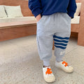 Boys' grey cotton sports trousers with elasticated waistband on child model