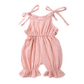 Baby girls sleeveless solid cotton romper jumpsuit in pink, front view
