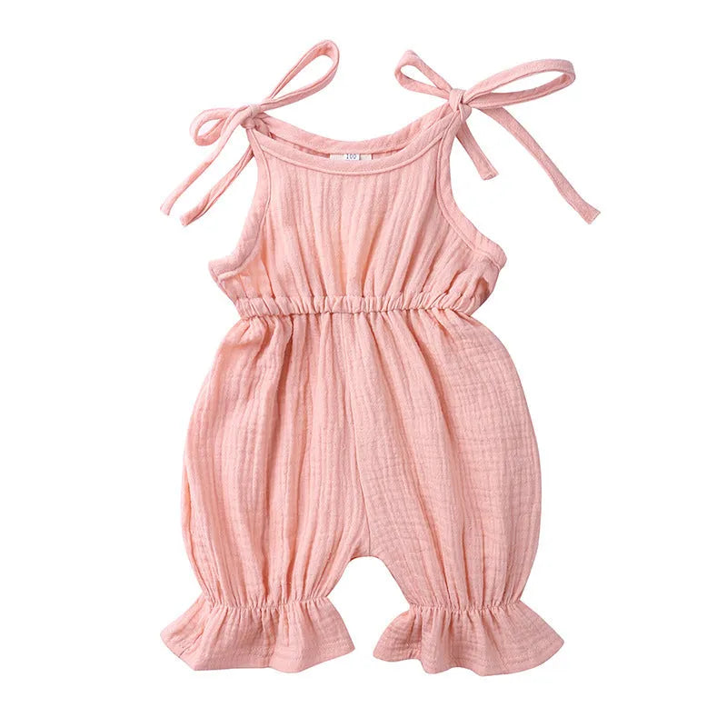 Baby girls sleeveless solid cotton romper jumpsuit in pink, front view