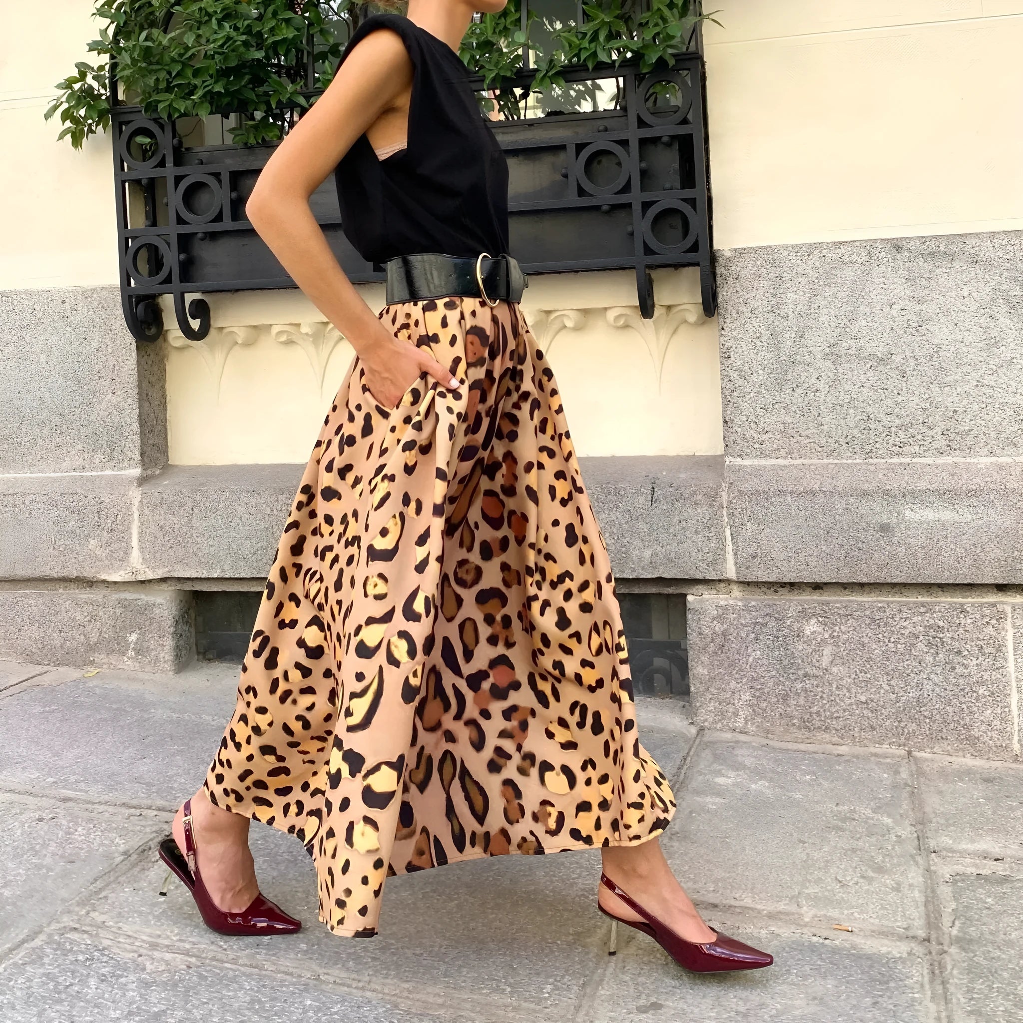 Brown leopard print women's long A-line skirt with a big hem, laid flat.