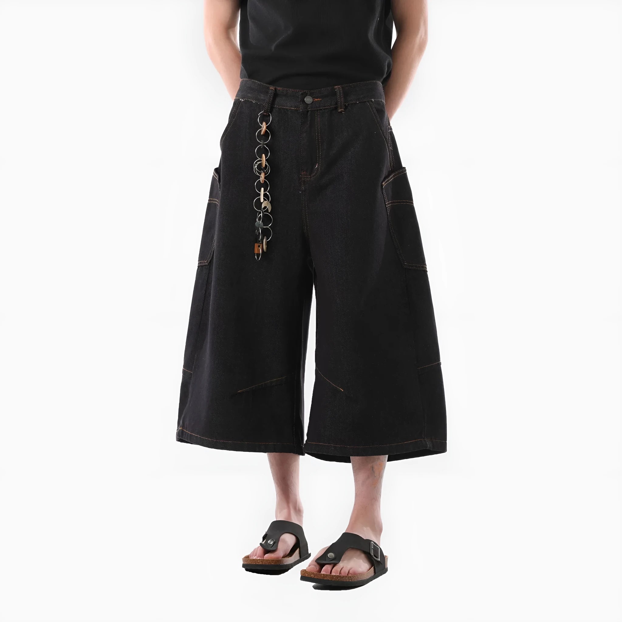 Man wearing black retro washed straight-leg denim cropped pants with side pockets.