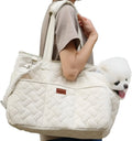 Grey cat carrier small dog handbag with breathable mesh top and side panels, safety cord, and soft cushion on a picnic table outdoors