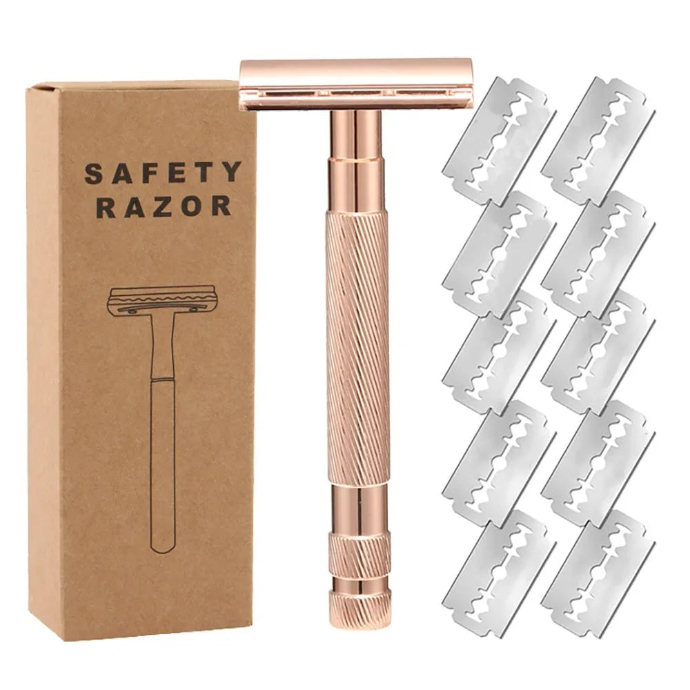 Manual double-sided safety razor with alloy handle, shown with replacement blades on a towel.