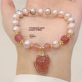 Light pink freshwater pearl bracelet for women with a dangling silver fox charm.