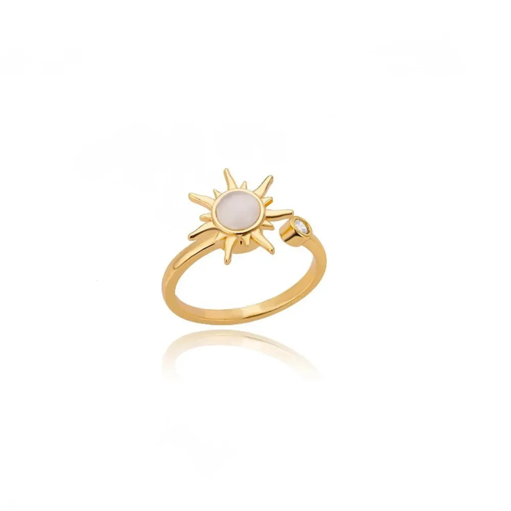 Adjustable copper decompression ring with rotatable element in gold or platinum finish