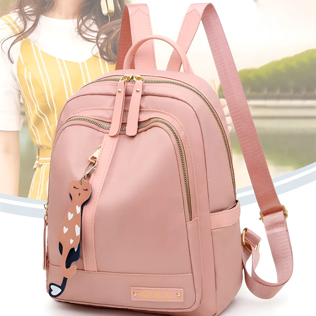 Black nylon casual backpack with square vertical shape, soft handle, and three-dimensional outer pocket