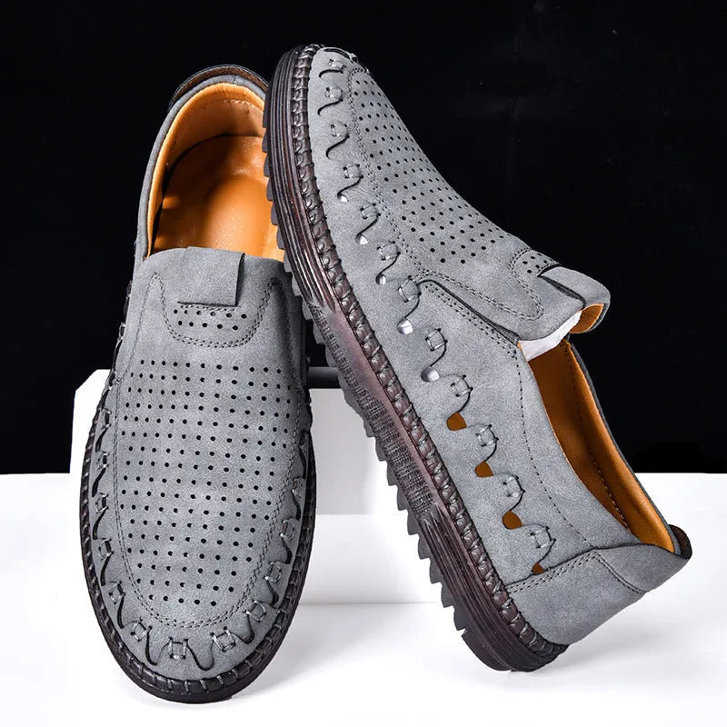 Men's brown slip-on casual shoes with round toe and hollowed-out pattern detailing