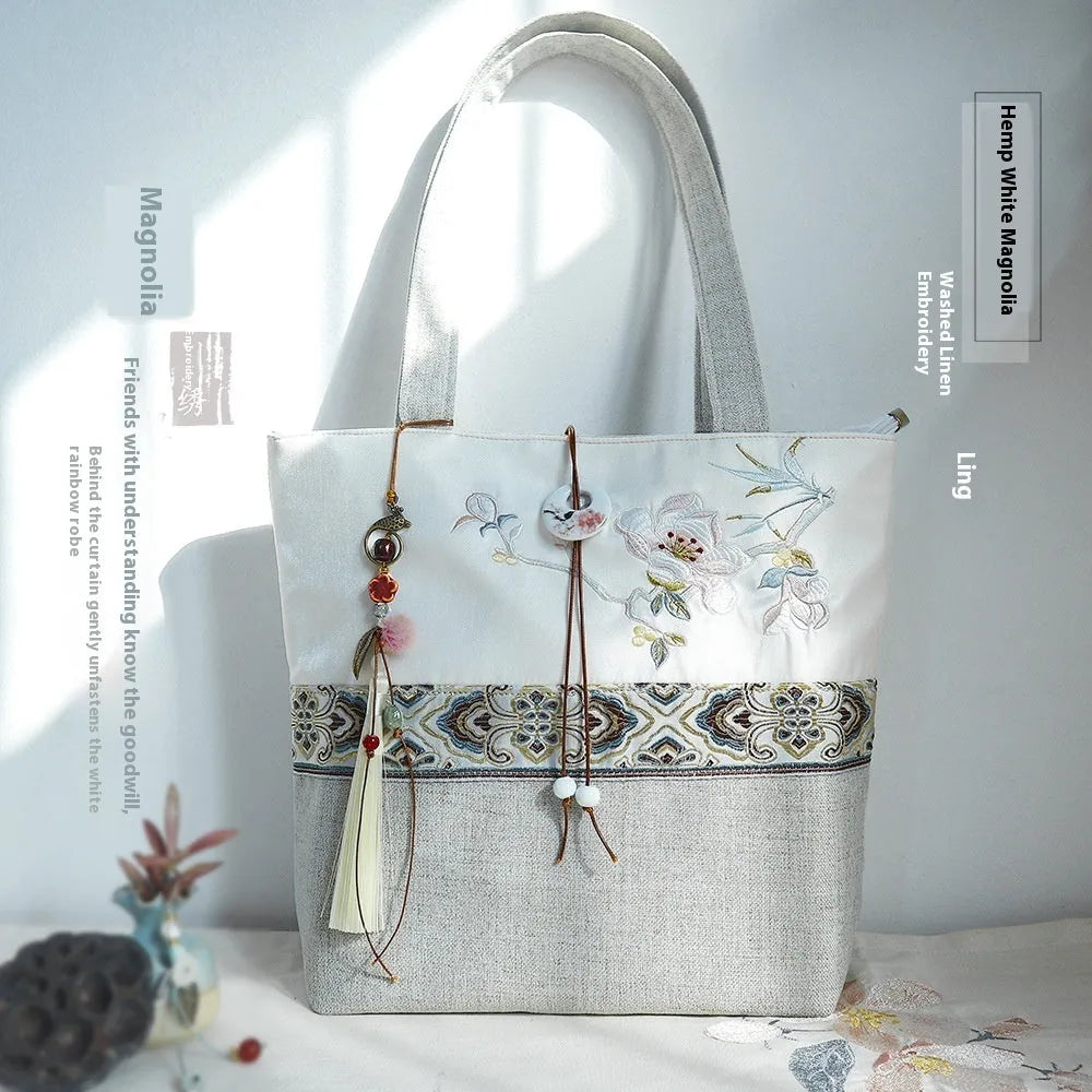 Artistic retro canvas shoulder handbag with hand-painted literary design and copper zipper