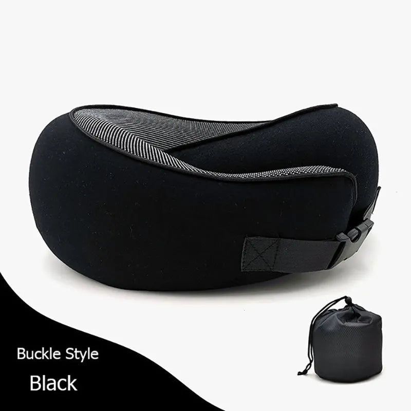 U-shaped memory foam travel neck pillow rolled up next to its carry bag, showing navy blue and grey colour options.