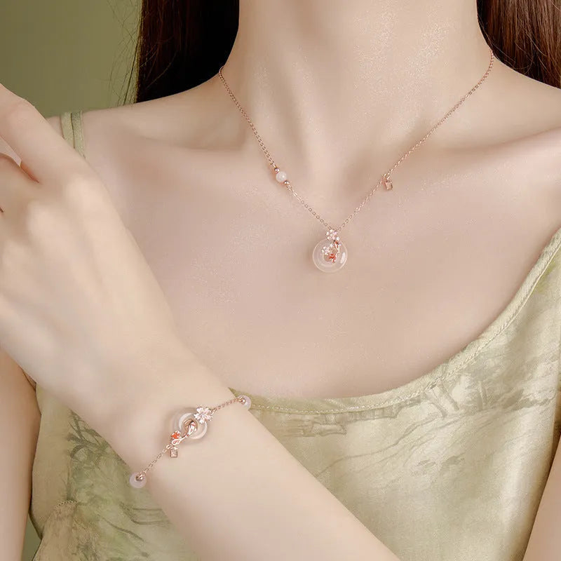 S925 sterling silver bracelet with white chalcedony crystals and a floral koi design.