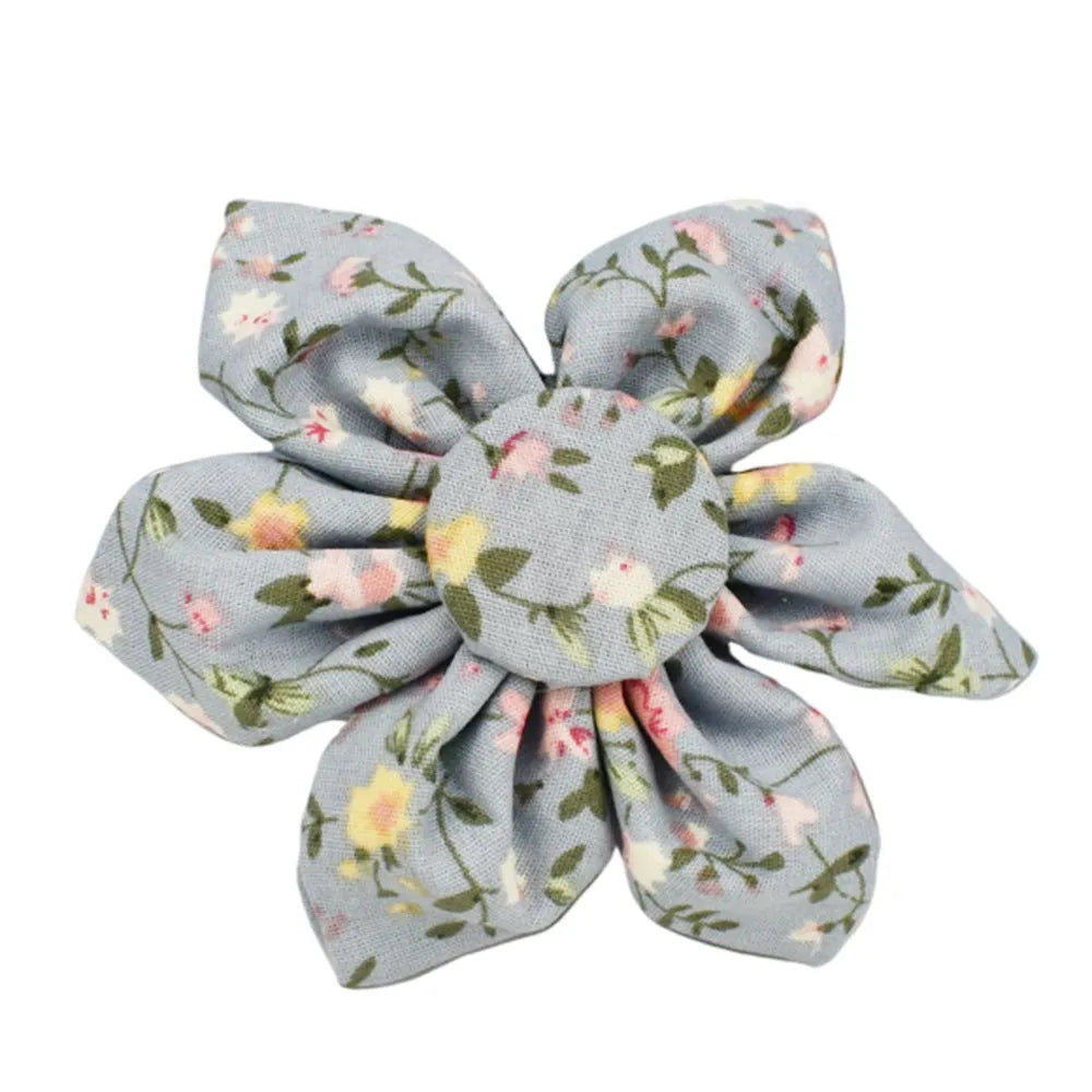 Blue floral patterned dog collar set with matching leash, bow, vest, and poop bag accessories