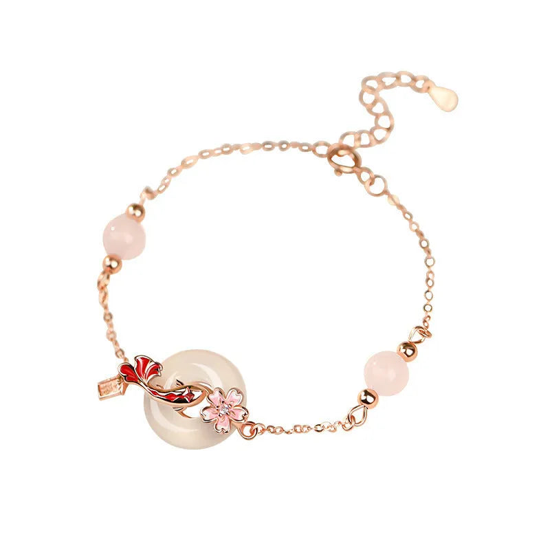 S925 sterling silver bracelet with white chalcedony crystals and a floral koi design.