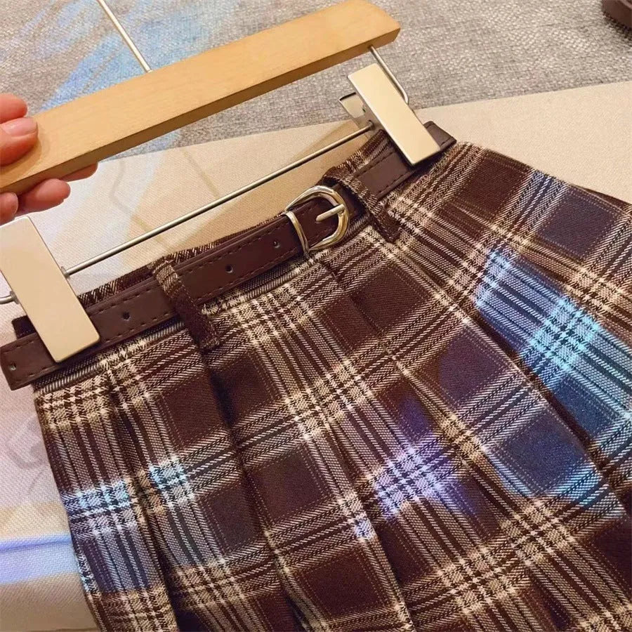 Girls' plaid pleated skirt in cotton blend fabric showing A-line silhouette