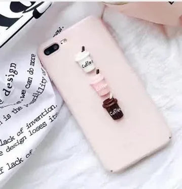 Soft pink silicone iPhone case with a 3D cartoon cat design on the back.