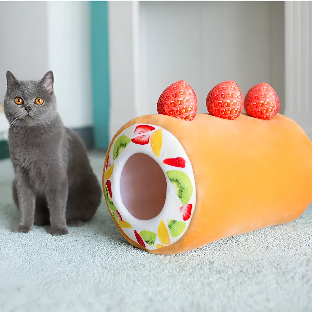Yellow cake roll shaped plush cat toy with short plush fur on a neutral background