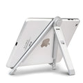 Silver metal adjustable triangle stand holding a mobile phone on a flat desktop