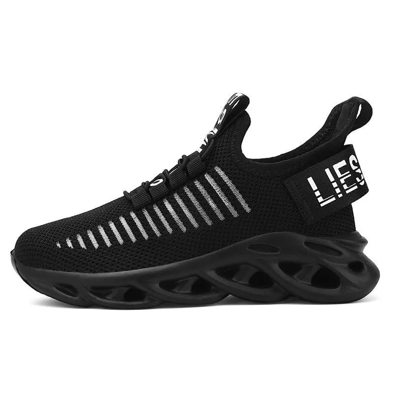 Kids casual black fabric sneakers with Velcro strap and lightweight EVA sole.