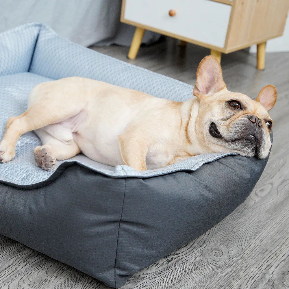 Soft grey dog bed with raised sides and a removable cover, shown in medium size.