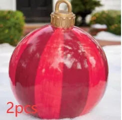 Large red and white striped inflatable Christmas ball ornament hanging on an outdoor tree
