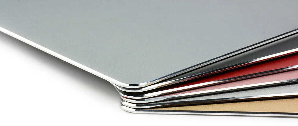 Aluminium alloy double-sided mouse pad in black finish on a desk for gaming or office use