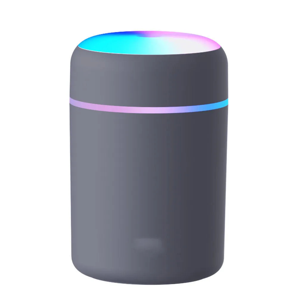 Mini horse USB humidifier aroma diffuser with transparent tank, black cover, and single fog nozzle on desk