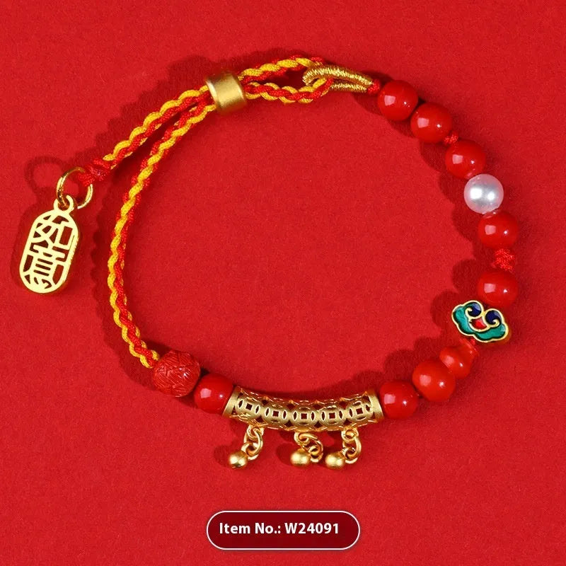Women's hand-woven cinnabar rope bracelet with round bell charm in emperor red sand colour