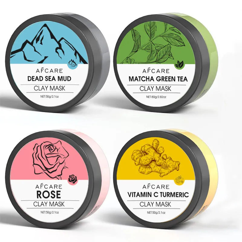 Set of four 80ml clay face mask jars: Dead Sea mud, green tea, turmeric, and rose formulas.