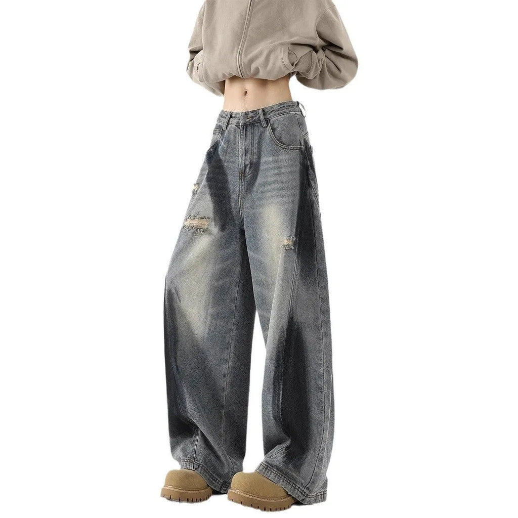 Men's blue ripped jeans with splash-ink wash pattern and loose fit silhouette