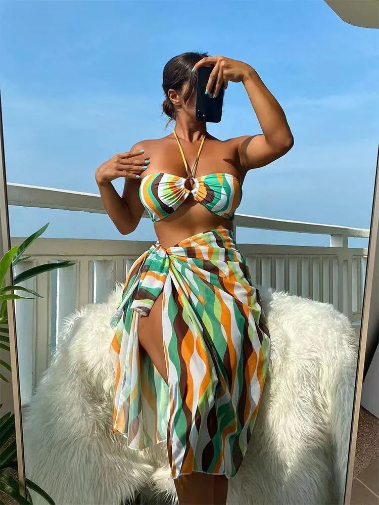 Yellow green women's split swimsuit three-piece set with printed beach skirt.