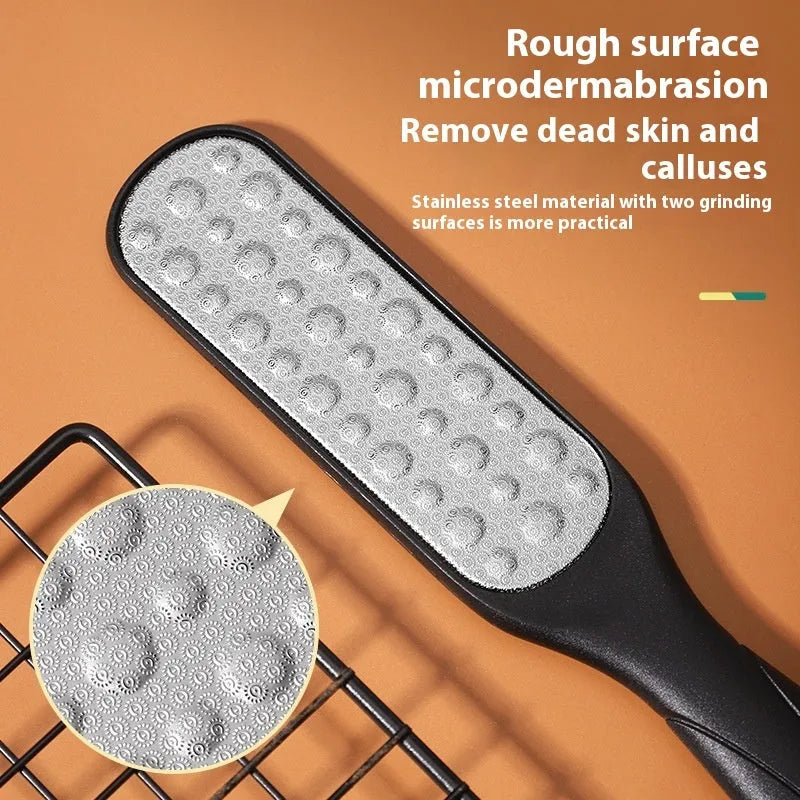 Double-sided stainless steel foot grinder with white and black sandpaper surfaces for callus removal