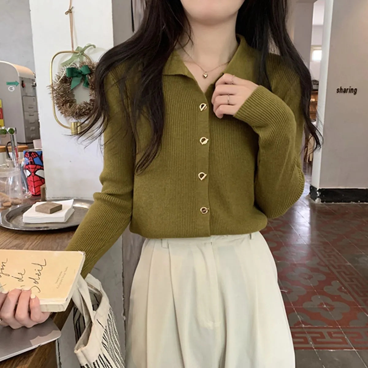 Loose fit long sleeve viscose knitted cardigan in beige, shown worn open.