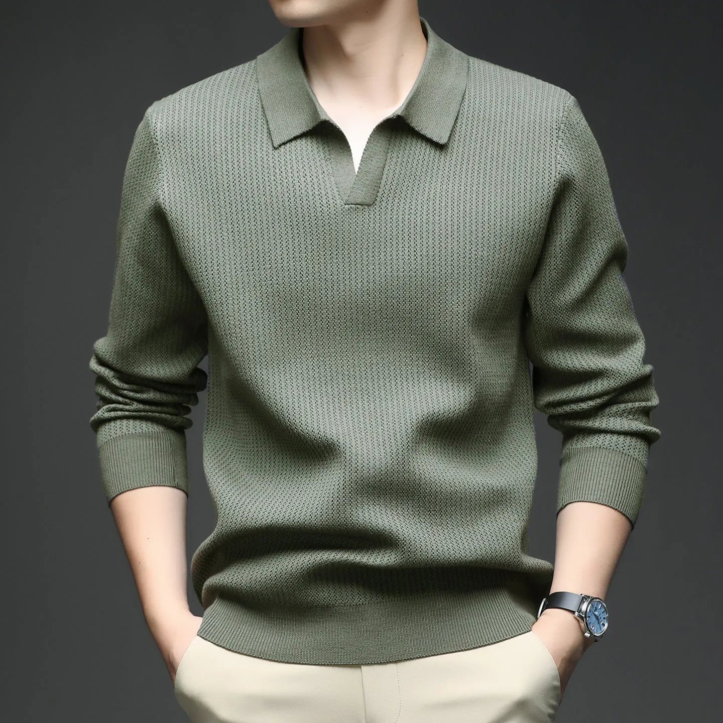 Men's loose fit casual green pullover sweater for autumn layering on a hanger.