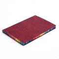 A5 rainbow side PU leather cover notebook open on a desk, showing lock line hardcover binding and 100g Daolin paper pages