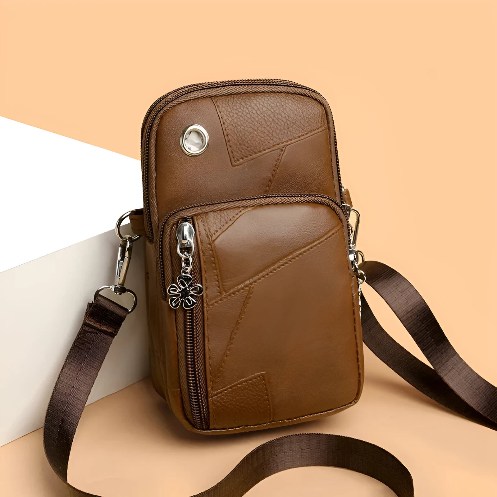 Square vertical mini mobile phone bag in PU leather, shown in water blue colour with a front sandwich pocket.
