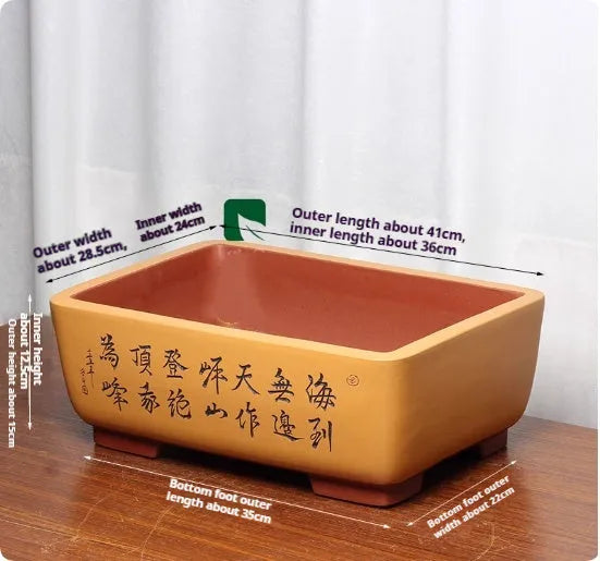 Purple clay Chinese style flower pot with plant on desktop, available in multiple colours and sizes