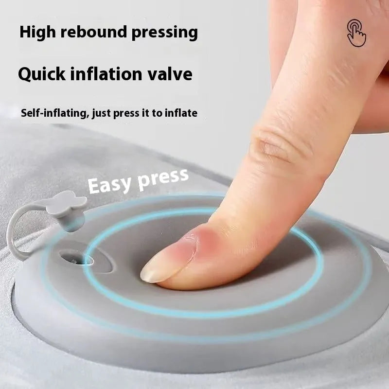 Red portable inflatable seat cushion shown folded and inflated on a wooden bench