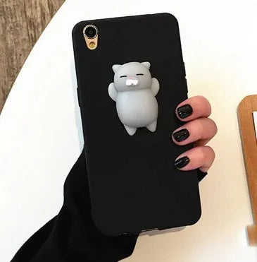 Soft pink silicone iPhone case with a 3D cartoon cat design on the back.