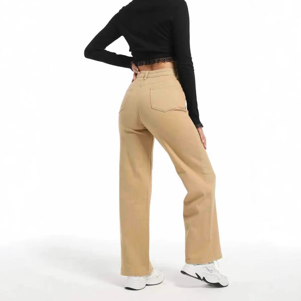 Women's high-waist straight leg cotton trousers in apricot colour, showing wide-leg silhouette.