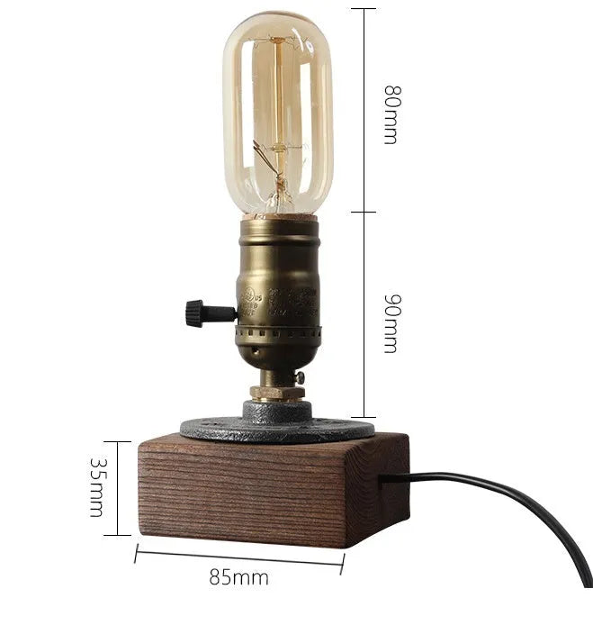 Water pipe table lamp with wood and iron construction, 9 cm wide, 13 cm high, on a wooden bedside table