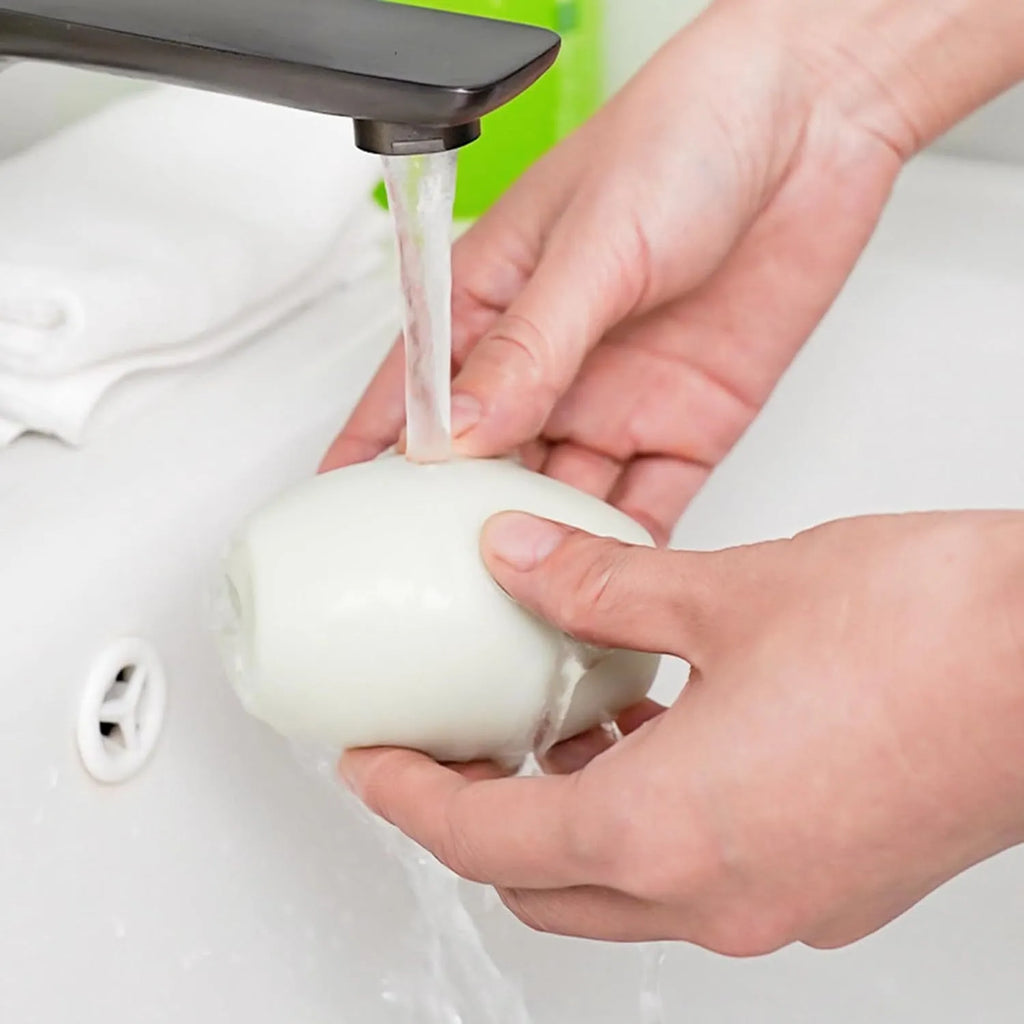 Green washable gel lint roller ball for portable pet hair removal on fabrics