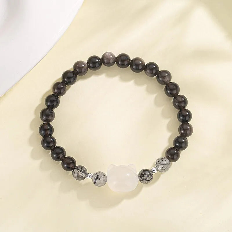 Silver obsidian cat bracelet with engraved design and electroplated finish