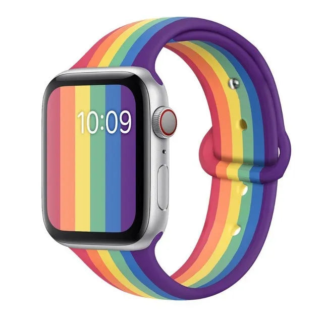 Silicone sports wristband with single buckle in black, rainbow, or white colours showing two size options