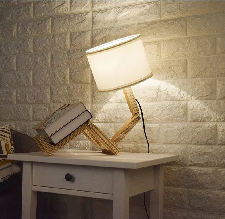Creative wooden humanoid table lamp with white fabric shade, deformable design, 22x44x16cm
