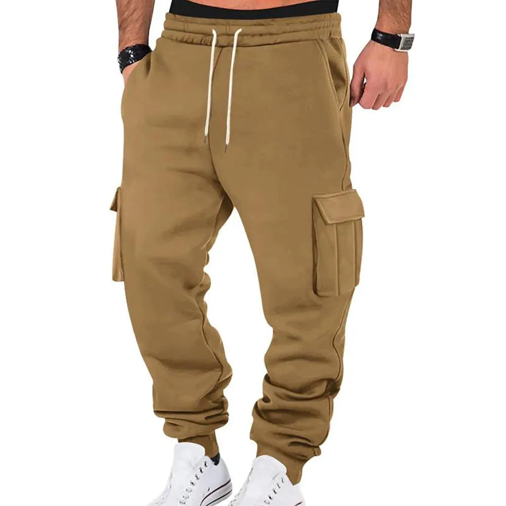 Men's solid colour casual multi-pocket drawstring sports pants in black, featuring polyester fabric and mid-waist design