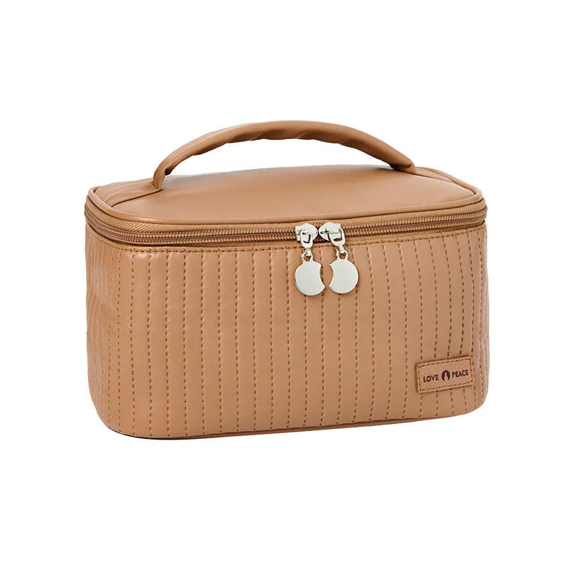 Open-top cake-shaped women's makeup bag in PU leather, shown in a soft solid colour.