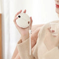 Green, pink or white 5000mAh power bank with digital display and integrated hand warmer function.