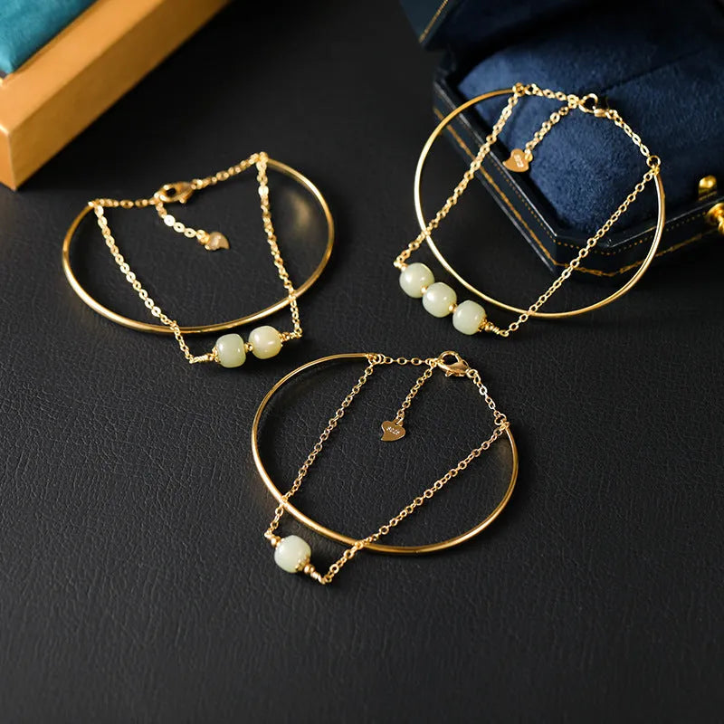 Women's jade lucky beads bracelet with gold inlay treatment in single, double, and three bead styles.