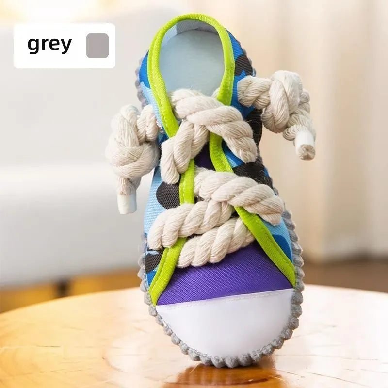 Dog toy shaped like cotton rope slippers with shoelaces, sole patterns, and built-in sound devices for playtime
