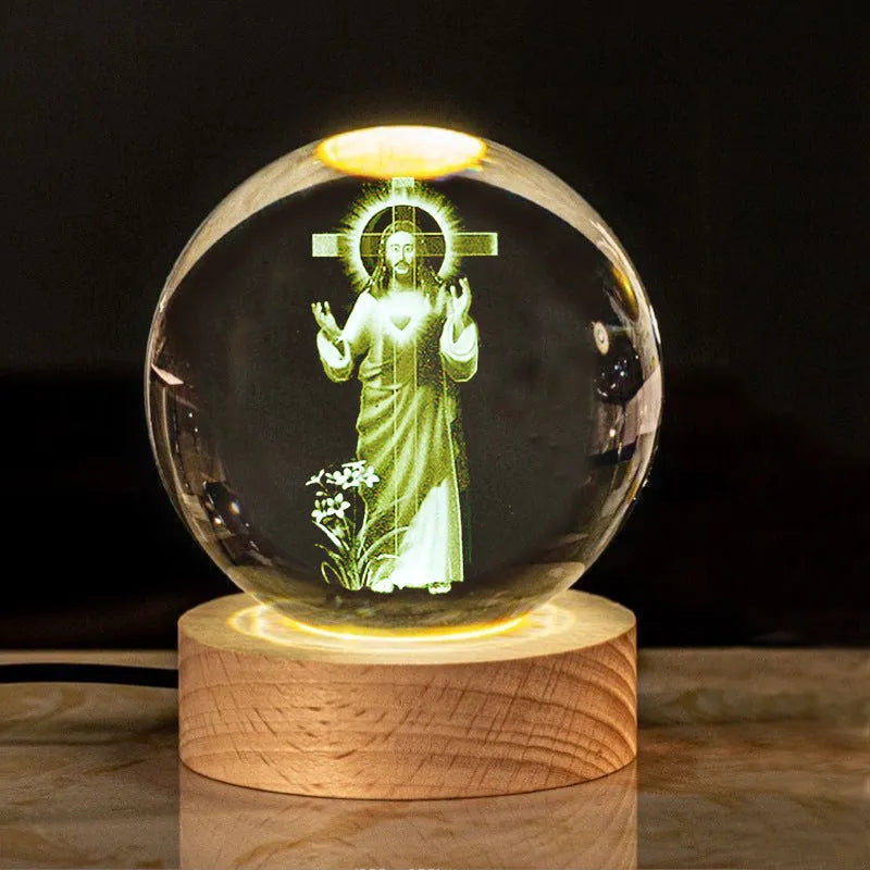 White crystal ball desk ornament with wood base and religious design inside