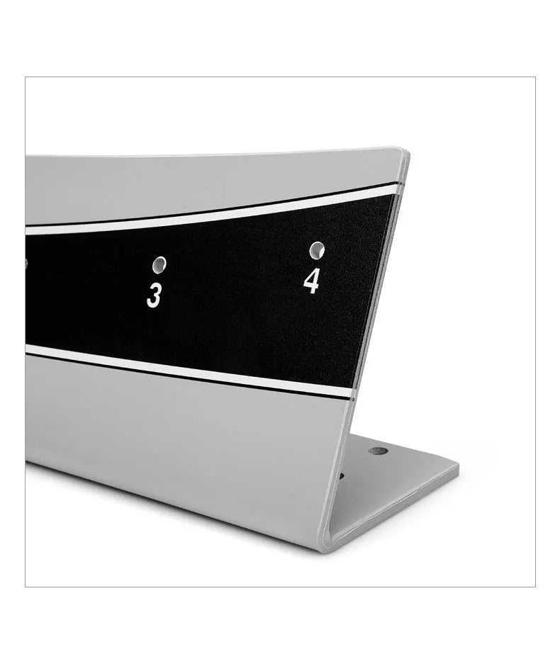 A white PVC golf putter trajectory balance simulator with an adjustable push rod balancer on a grey surface.